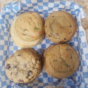 four muffins in a basket