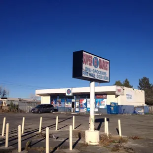 a parking lot with a large sign