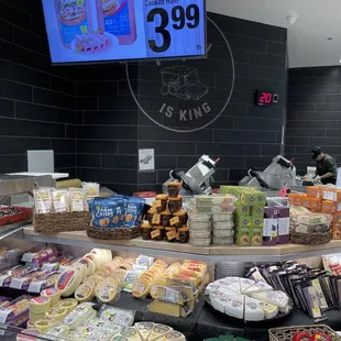 a display of cheeses and other foods