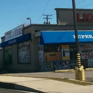 a liquor store on the corner of a street