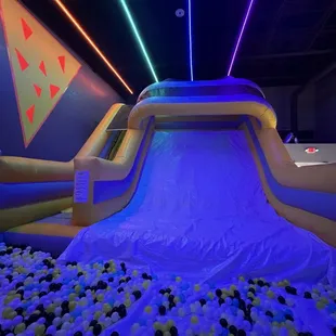 Giant slide leading into ball pit (ankle deep)