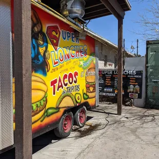 a taco truck parked in a parking lot
