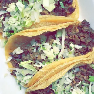 three tacos on a plate