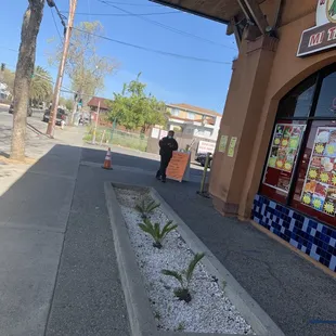 a man walking down the sidewalk