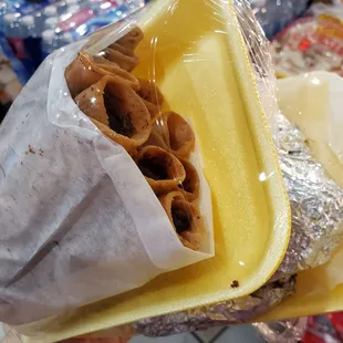 a sandwich wrapped in foil