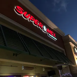 the front of a store at night