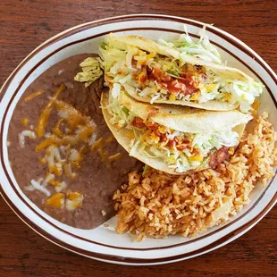 Our two Taco Plate chicken, beef, or Potato Crispy Tacos with Rice and Beans.