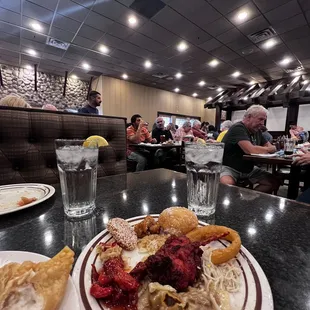 a plate of food and a glass of water