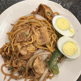 Mongolian grills chicken and vegetables.