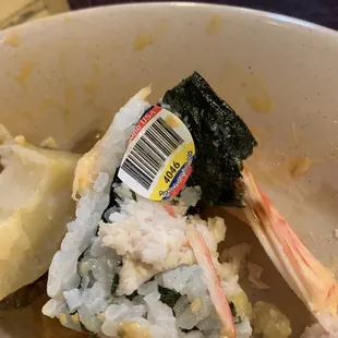 Cut into my sushi (not proud of it) and found this barcode sticker inside lol