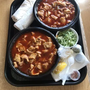 two bowls of soup on a tray