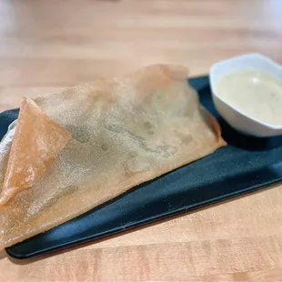 Complimentary - crispy wonton skin with Thai curry sauce.
