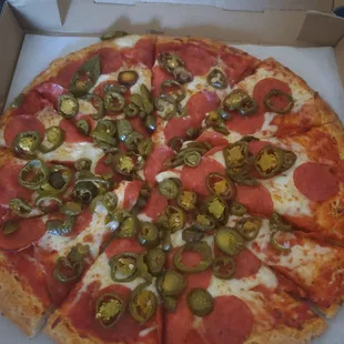 Large jalapeño and pepperoni pizza.