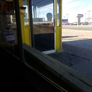 a parking meter on the side of a building