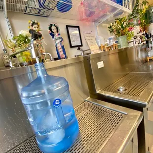 a large bottle of water on the counter
