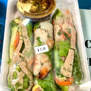 Hmong style spring rolls. Their sauce has a spicy kick to it. Very good