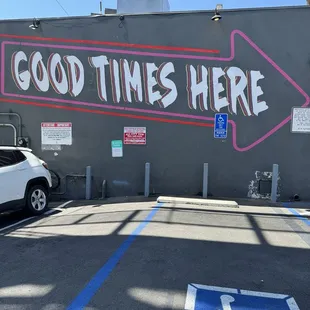The side of the building.Good Times Here. Super Rad Sub Shop is a Sandwich Window located on Sunset Blvd.next to The Naughty Pig.