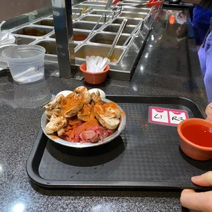 a plate of food on a serving tray