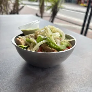 Chicken bowl with peppers and onion