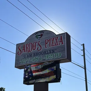 a sign for sardo&apos;s pizza