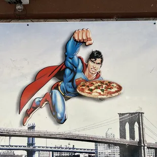 a superman flying over a bridge