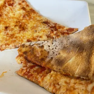 two slices of pizza on a plate