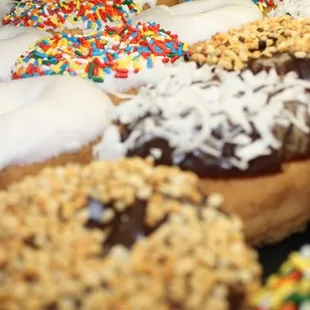 a variety of donuts with sprinkles