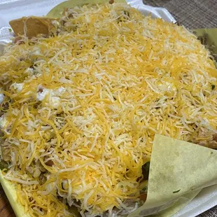 a mexican dish in a takeout box