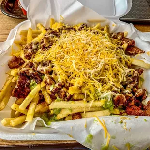 a tray of fries and cheese