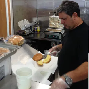 a man preparing food in a commercial kitchen