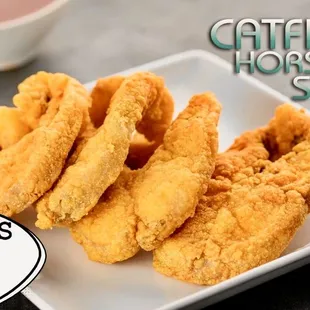 a plate of fried fish