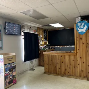 Growler area with rotating beer menu on TV