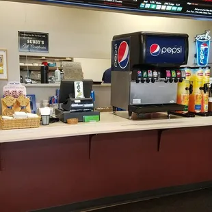 a counter with a soda machine