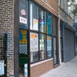 a brick building with a storefront