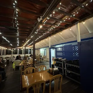 Their patio dining area! Super cute with lights and heat lamps