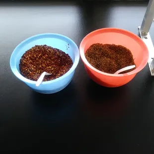 Spices at the salsa bar! Red pepper flakes and oregano ( i believe )
