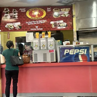 The nice cashier at the front taking orders