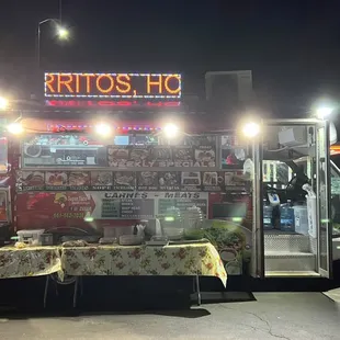 a man standing in front of a food truck