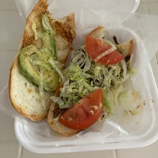 a sandwich in a styrofoam container