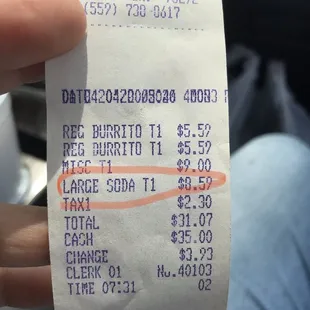a person holding a receipt in their hand