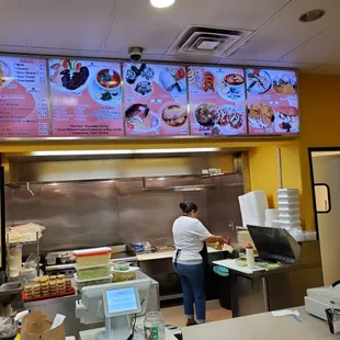 a woman preparing food in a restaurant