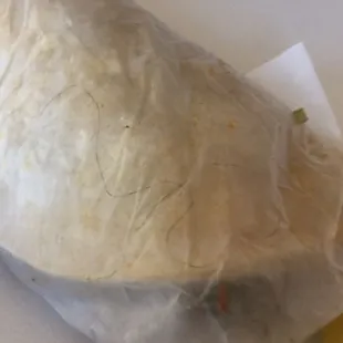 Asada tacos with extra black curly hair