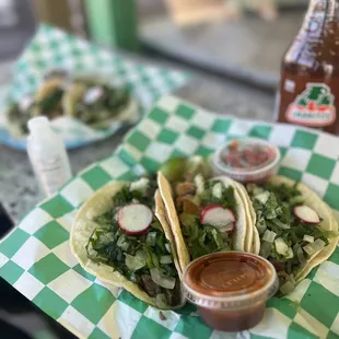 a plate of tacos and salad