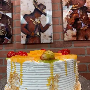3 Leches cake with fruits and coconut flakes.