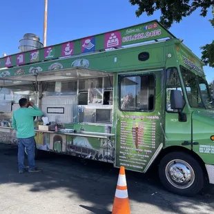 a man ordering food from a food truck