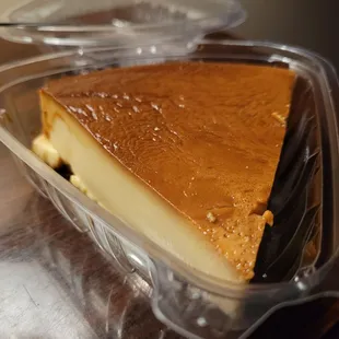 a piece of cheesecake in a plastic container