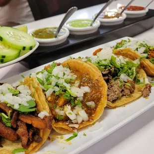 three tacoss on a long plate