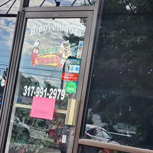 the reflection of a storefront window