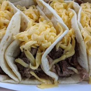 Taco morales: beef fajita, beans and yellow cheese