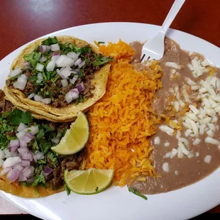 Carne asada tacos with rice and beans